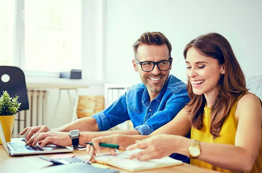 Couple working on finances at table