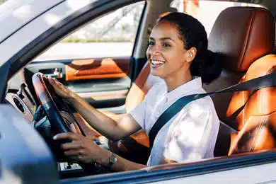 women driving car